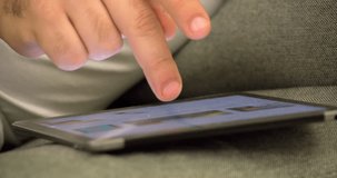 Man hand using tablet pc 4k video. Close-up of finger click, touch, typing on touchpad computer screen