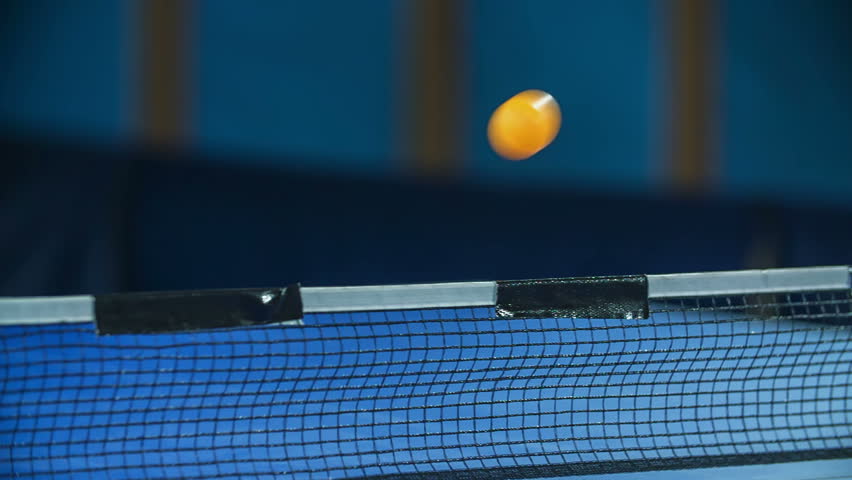 We can see a yellow ping pong ball travelling from one side of the table to another. Kids are playing table tennis in school. - Powered by Shutterstock - Get 15% off with code: PIKWIZARD15