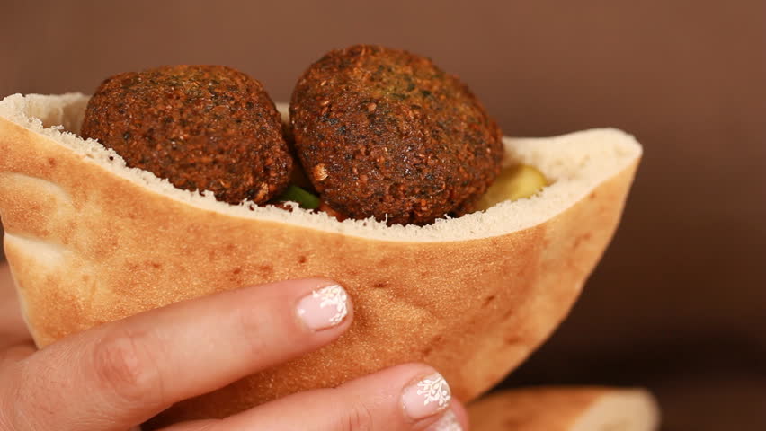 Female chef's hands cook Falafel or felafel deep-fried ball made from ground chickpeas Tahini Middle East Royalty-Free Stock Footage #30859492
