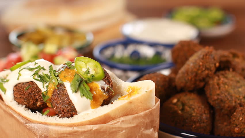 Cook Falafel or felafel deep-fried ball made from ground chickpeas Tahini Middle East Royalty-Free Stock Footage #30859510