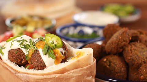 Cook Falafel or felafel deep-fried ball made from ground chickpeas Tahini Middle East