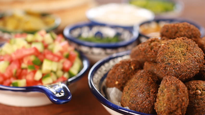 Cook Falafel or felafel deep-fried ball made from ground chickpeas Tahini Middle East Royalty-Free Stock Footage #30859519