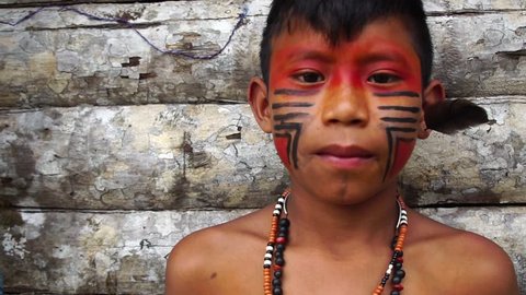 Native Brazilian Boy on a indigenous Tupi Guarani Tribe in Brazil