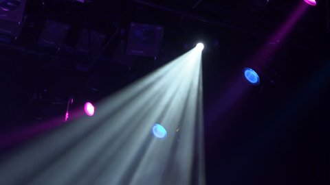 The spotlight through the smoke on stage. Lighting equipment. Effect Lights. Scanner. Color Changers. Moving Yoke. Moving Head.
