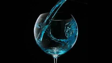Pouring blue water into glass shooting with high speed camera, phantom flex.