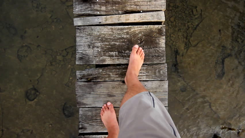 Walking on wooden dock

Description: Man walking on wooden dock
