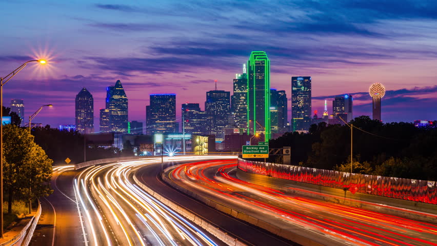 Dallas, Texas, USA downtown skyline and highway.