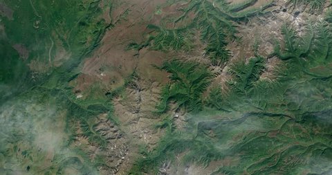 Very high-altitude overflight aerial of volcanic tundra, Kamchatka peninsula, Russia. Clip loops and is reversible. Elements of this image furnished by NASA