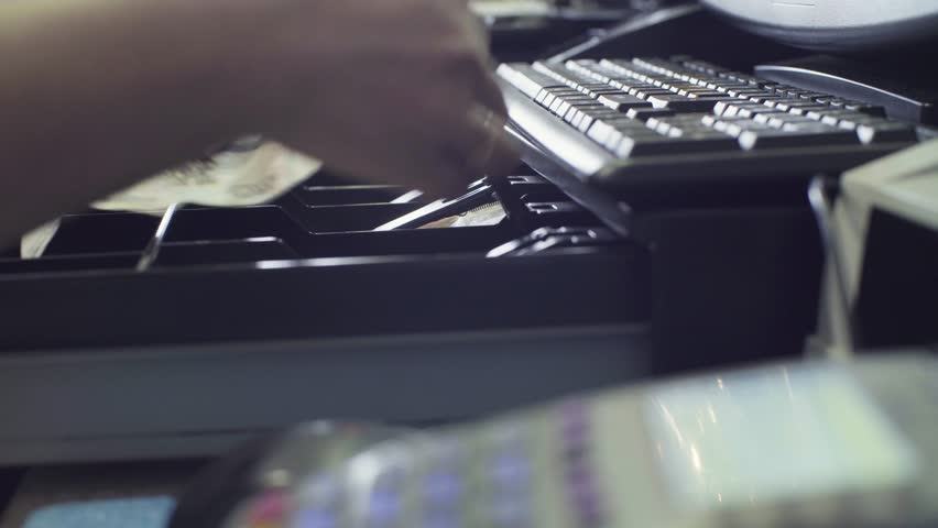 Close up man's hands putting money in cash box. Cash register and hands of cashier Royalty-Free Stock Footage #30902167