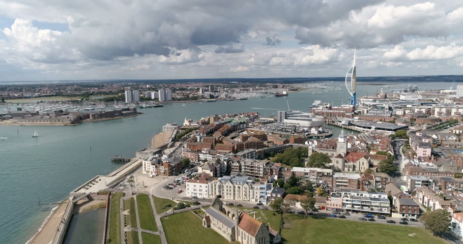 Aerial dolly view of the town and the bay of Portsmouth, Southern England