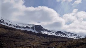 HD stock video of timelapse clouds over a volcanic mountain range in Iceland.