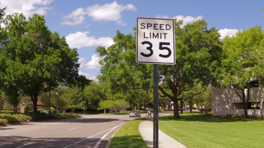 Speed Limit 35 Sign Isolated on a Beautiful Sunny, Summer Day Royalty-Free Stock Footage #30908257