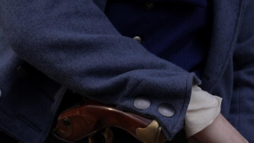 TEXAS - MARCH 2017 - Early 19th century Re-enactor, reenactment. Man portraying Colonel Travis, or Military commander - stone fort, defending in battle. Texans defend the Alamo. Reading letter in Hand
