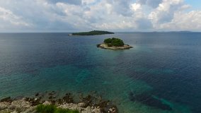 Aerial shoot of small island near Primosten on sunny day, Croatia. 2K7 video.