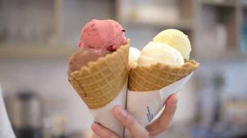 Ice cream Cones with Plomber, chocolate and fruity Scoops Gelato