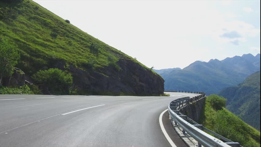 Driving on rural road to Grossglockner at the alps in Austria Royalty-Free Stock Footage #30927829