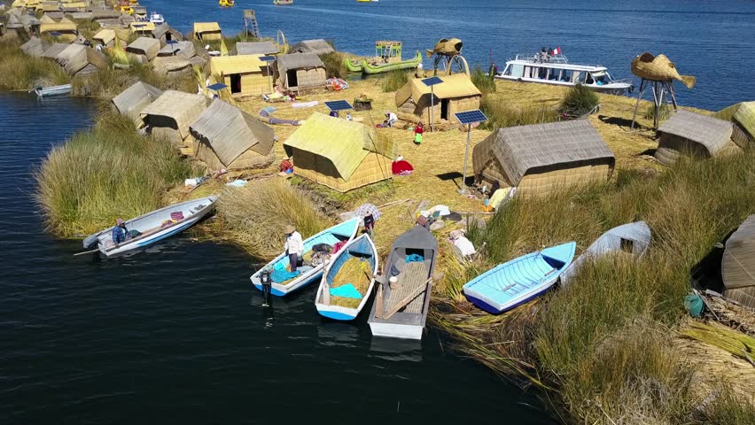 Aerial view of a lake titicaca, and floating uros islands. Shot in the Peruvian Andes.