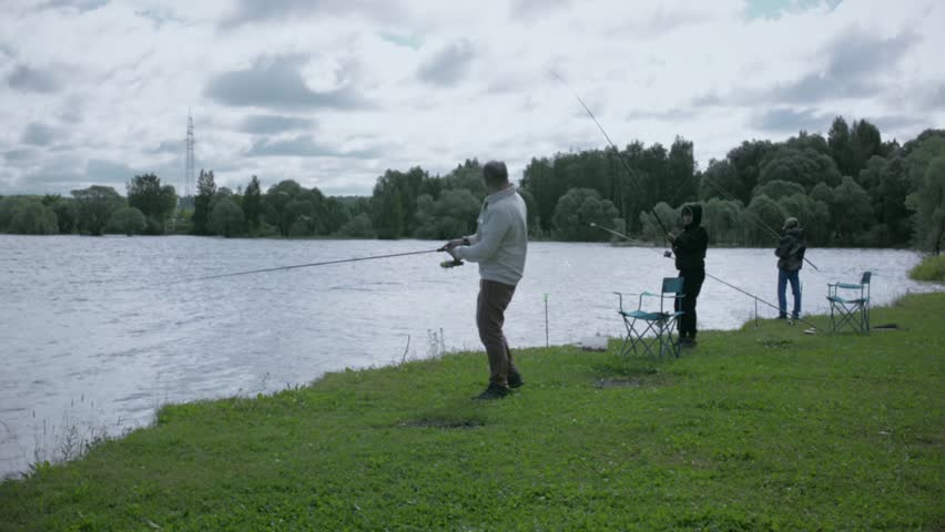 Children on fishing. Rest on the lake