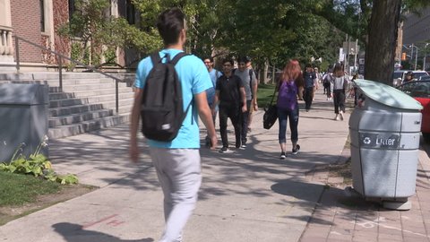 Toronto, Ontario, Canada September 2017 Diverse people walking down the street in Toronto university district