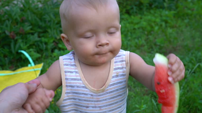 The child is eating a watermelon | Shutterstock HD Video #30943615