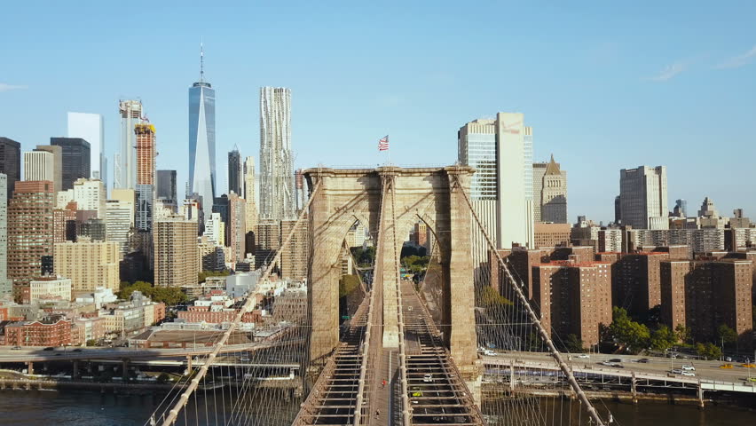 Aerial view of the Brooklyn bridge through the East river to Manhattan district in New York, America. Royalty-Free Stock Footage #30947086