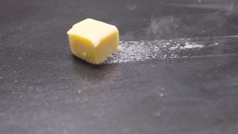 Cube of Butter Melting Sizzling Browning in Non Stick Pan Skillet in Slow Motion, Preparation for Cooking - 50 FPS