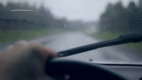 Rain Drops on Windshield During Storm. Driving in bad weather pov. 4K slowmotion.