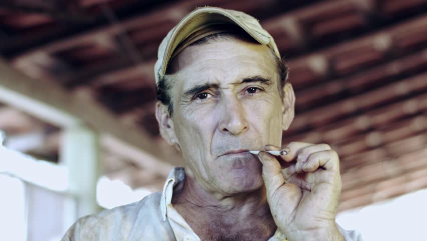 59.94fps (It can be in slow motion) Farmer smoking a cigarette - straw cigarette