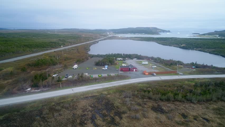 A beautiful aerial shot of a wet and cold arctic tundra RV park in the fog at St. Anthony Newfoundland Canada