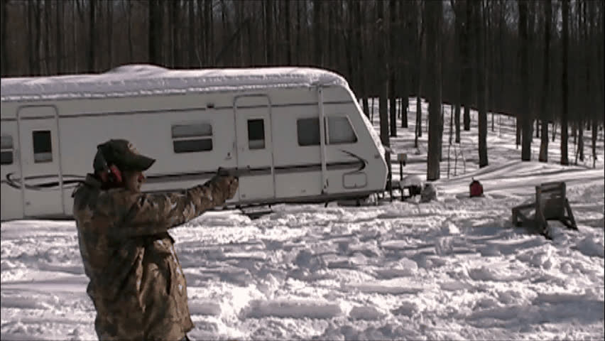 Man shooting a semi-automatic handgun.