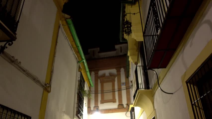Old houses on dark evening in Cordoba, Andalusia, Spain.