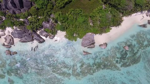 Overhead aerial view of beautiful Source D'Argent Beach in La Digue – Seychelles.
