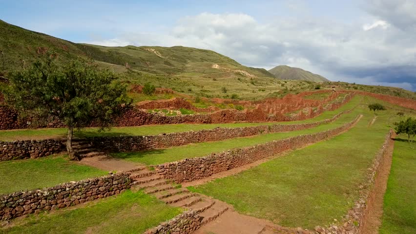 Drone flying around Peruvian ancient Inca ruins of Pikillacta. This beautiful ancient city is located on top of the mountain within the sacred valley of Peru. Color Corrected.