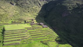 Aerial view around Peruvian ancient Inca ruins of Huchuy Qosqo. This beautiful ancient city is located on top of the mountain within the sacred valley of Peru.