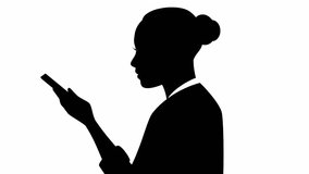 Video of a businesswoman silhouette with smartphone