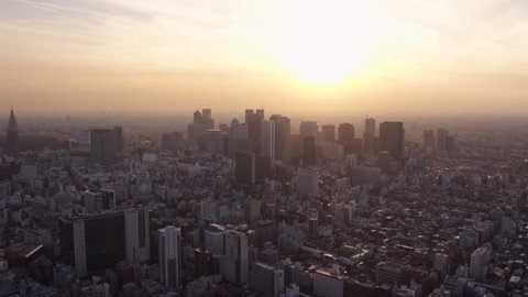 Japan Tokyo Aerial v152 Flying over Shinjuku area towards downtown cityscape views sunset