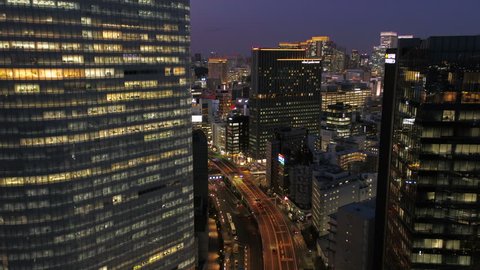 Japan Tokyo Aerial v146 Flying low over Hamarikyu park with Ginza cityscape views dusk 2/17