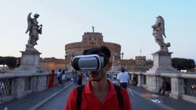 Man Wearing VR Headset on Ponte Sant'Angelo, Rome, Italy. Technology concept.