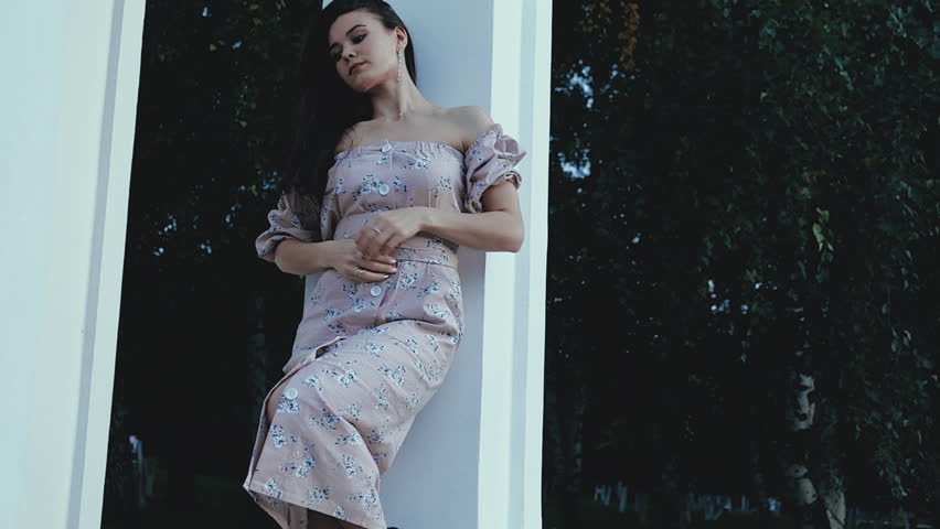 Happy beautiful woman walking in the city, steadicam shot 4k