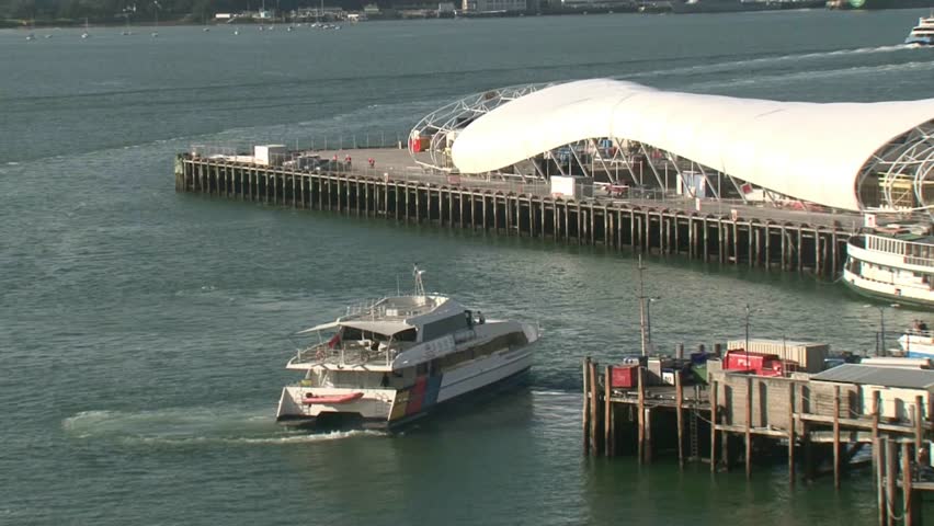 AUCKLAND, NEW ZEALAND - CIRCA JULY 2012: Passenger ferries approaching and