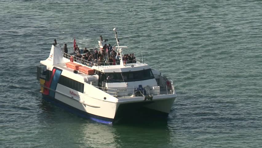 AUCKLAND, NEW ZEALAND - CIRCA JULY 2012: Passenger ferry approaching wharf at