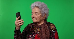 Elderly Woman Talk Online Team Conference Mobile Phone Green Screen Background