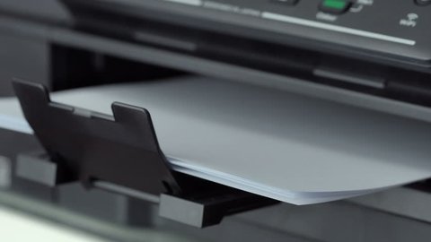 Closeup shot of Printing document paper with inkjet printer
