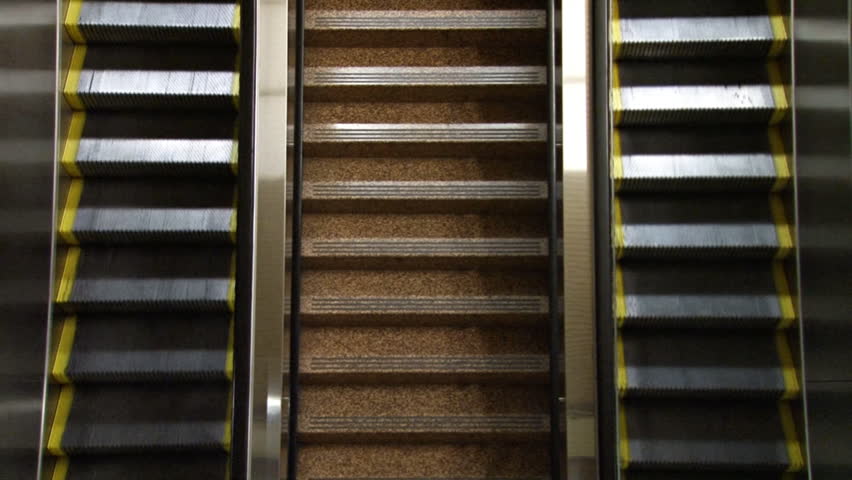 Looking down on an empty escalator.