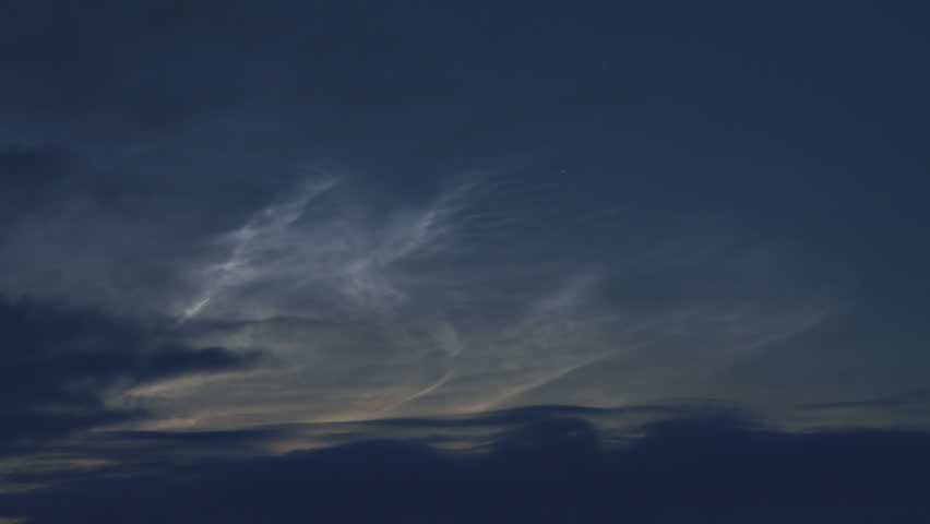 Spooky clouds creeping and morphing over an Alaskan sky in the early morning.