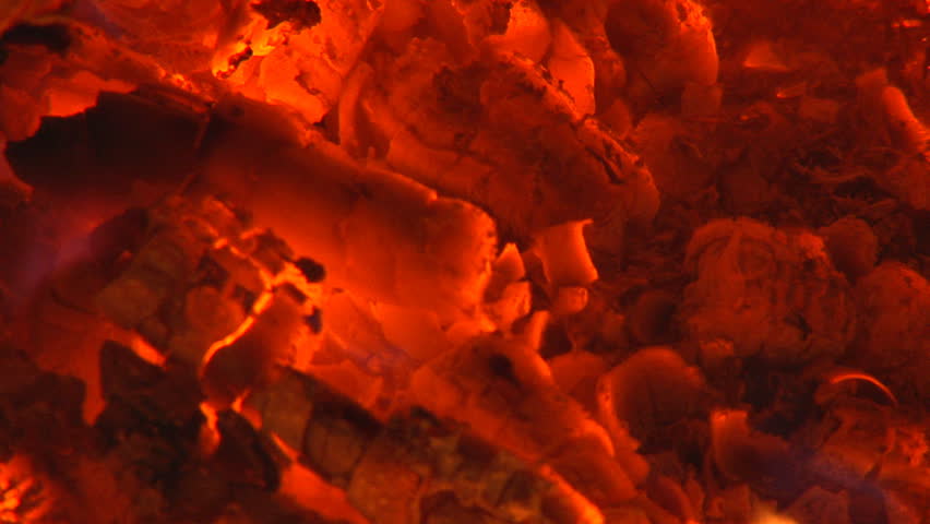 Intimate view of the embers of a bonfire.