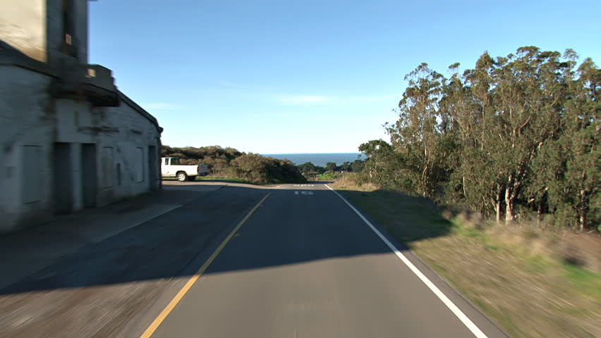 First-person POV shot of driving on Conzelman Road at the Marin Headlands, past