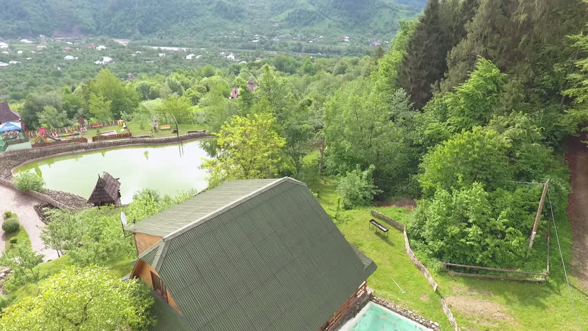 Tourist complex and the pool at mountains and forest. Forest panorama.