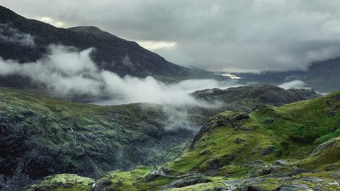 Snowdonia National Park- time lapse of cloud inversions and hikers walking up popular Pyg track on route to the summit of Mount Snowdon