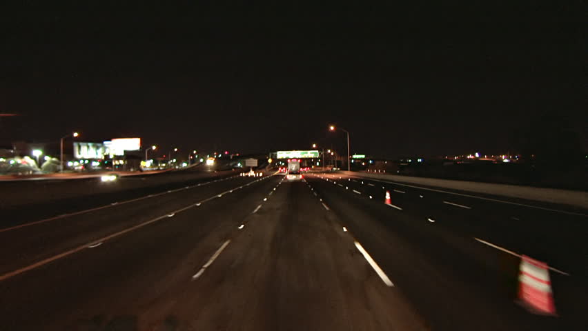 Nighttime POV driving shot of Interstate 80, heading toward the Oakland-S.F. Bay